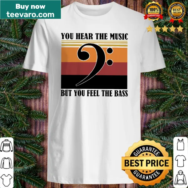 Vintage-style shirt with musical notes and text about feeling the bass