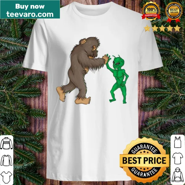Funny Bigfoot and alien high five graphic on a t-shirt