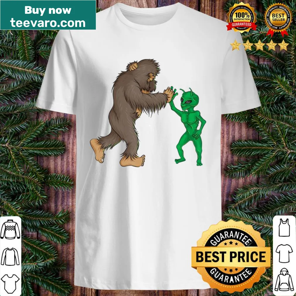 Funny Bigfoot and alien high five graphic on a t-shirt