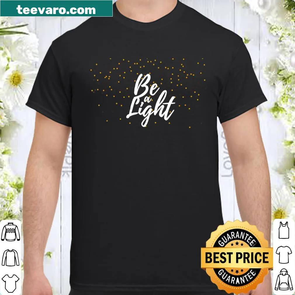 Inspirational women's T-shirt with the phrase 'Be A Light' in hand-lettered style.