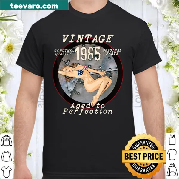 Distressed shirt with 1985 bomber nose art pinup graphic.
