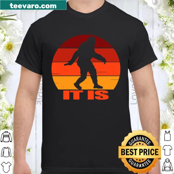 Retro-style shirt with a whimsical design of Bigfoot against a sunset.
