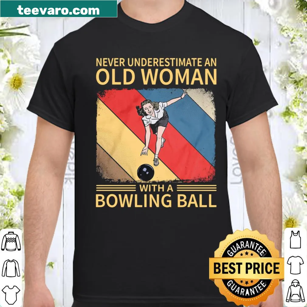 Humorous shirt with the phrase 'Never Underestimate An Old Woman With A Bowling Ball' and a bowling ball graphic
