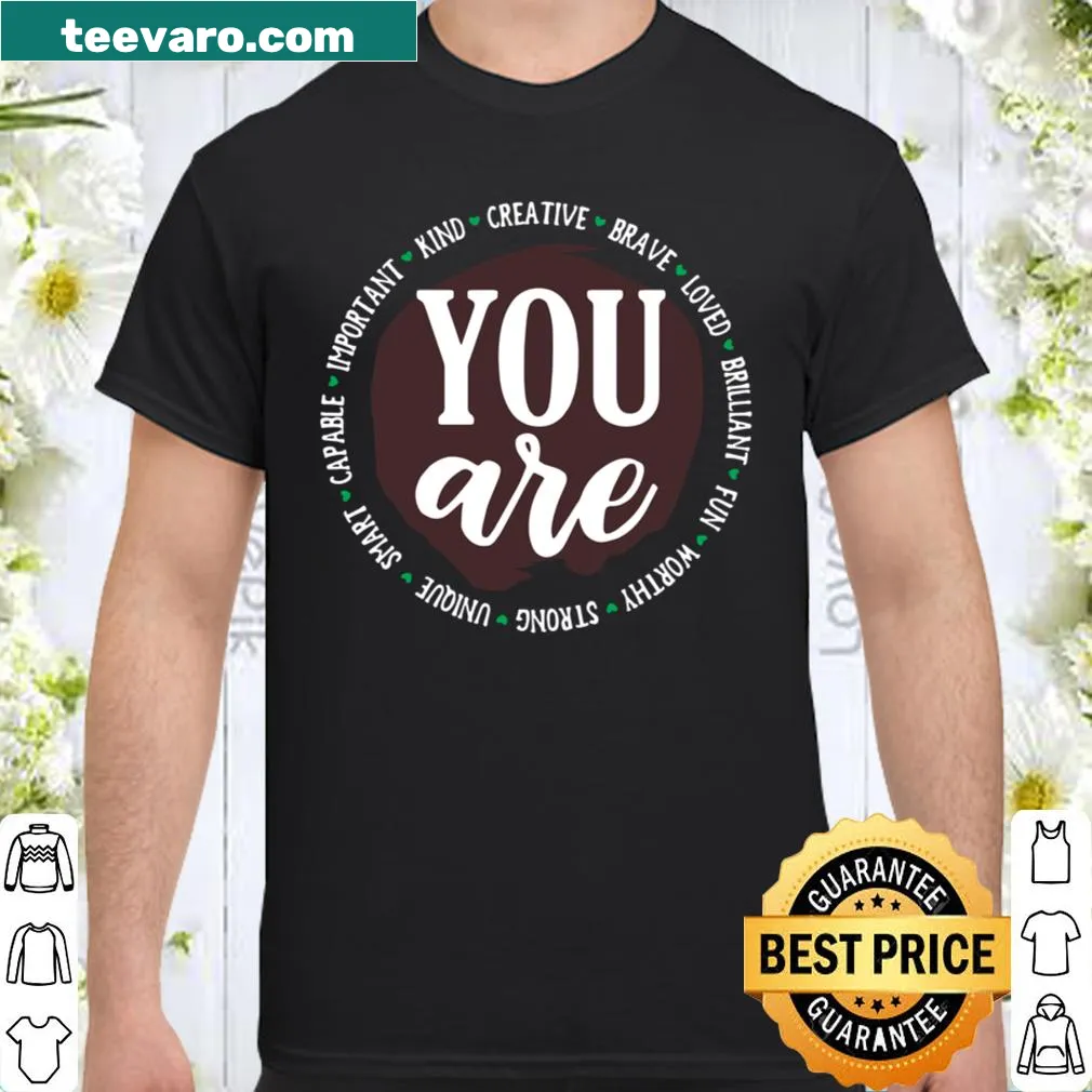 Positive affirmation shirt featuring various uplifting words in typography.