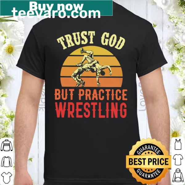 Text 'Trust God But Practice Wrestling' on a shirt