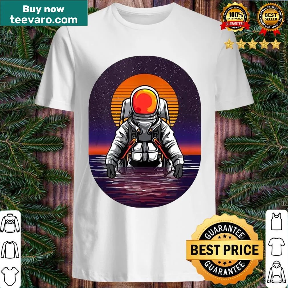 Astronaut graphic against an ocean sunset scene on a t-shirt