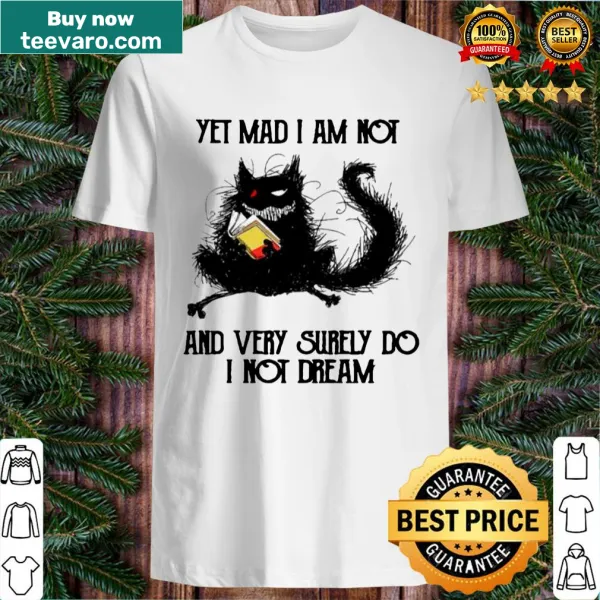 Whimsical shirt featuring a playful phrase about black cats and dreams