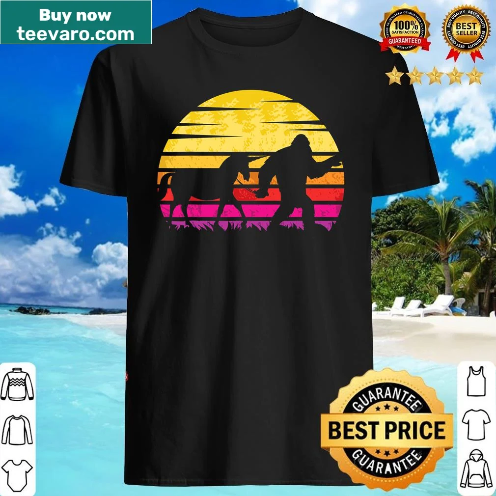 Cartoon shirt featuring Bigfoot and a unicorn walking together