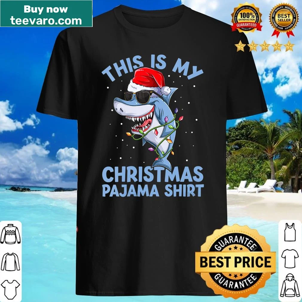 Santa Claus with a shark hat graphic on a Christmas shirt