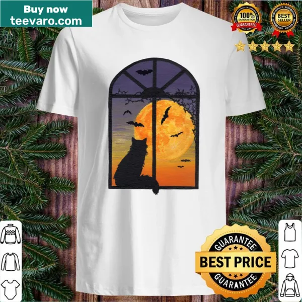 Cute Halloween-themed shirt featuring a cat looking out a window