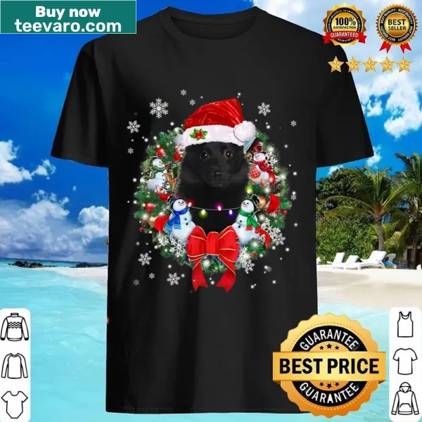 Schipperke in a Christmas wreath graphic on a shirt