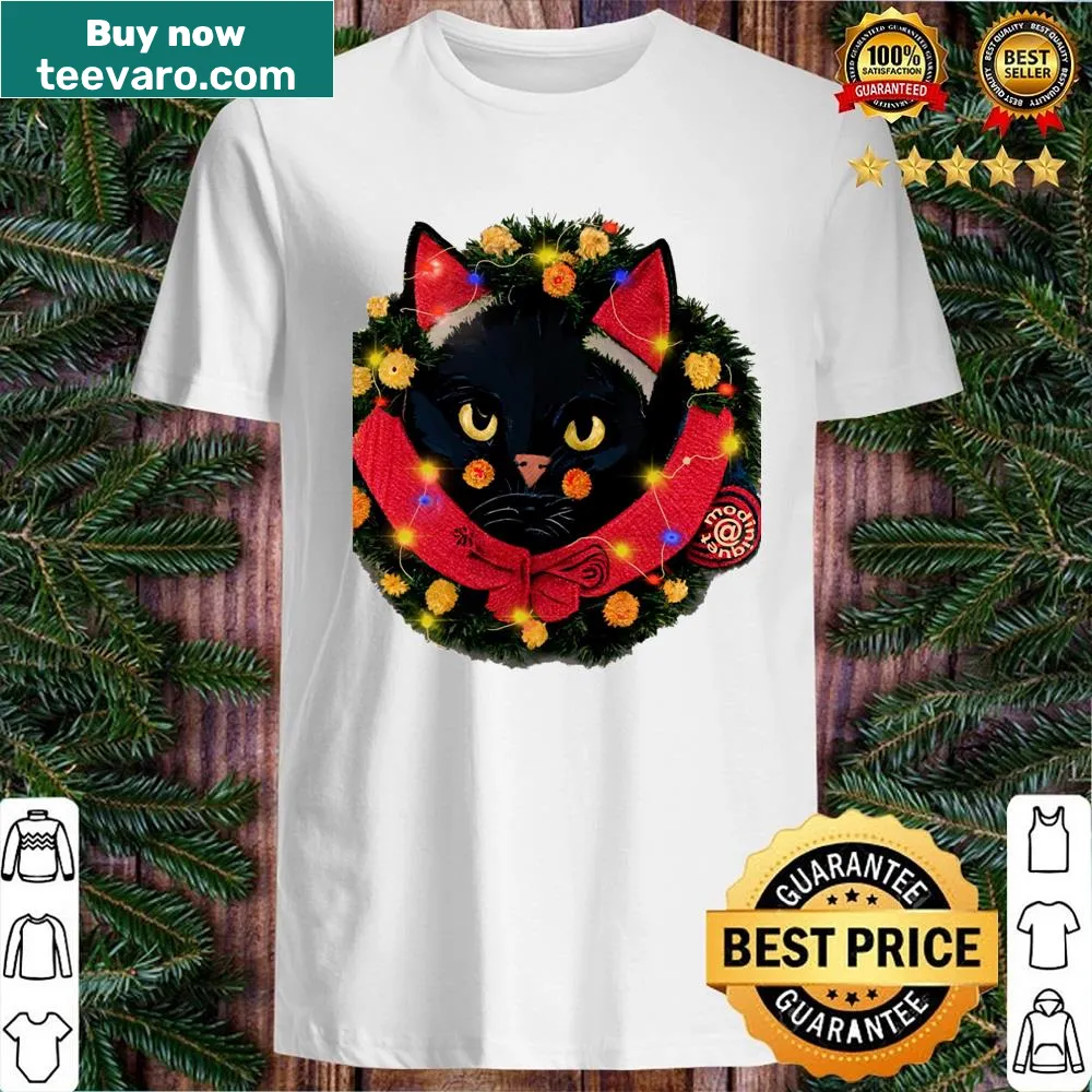 Whimsical cat design with holiday decorations on a festive shirt
