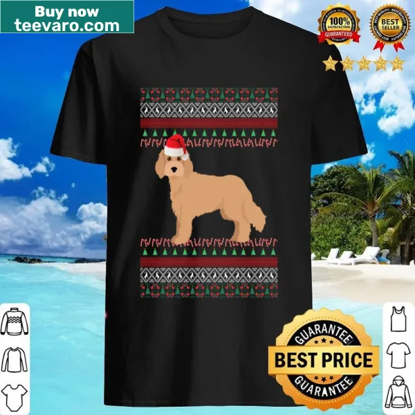 Cavapoo wearing a Santa hat on an ugly Christmas shirt