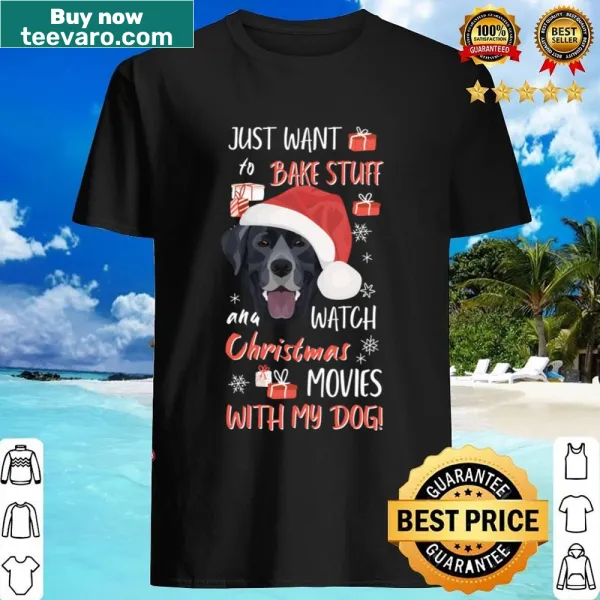 Labrador wearing festive decorations on a Christmas shirt.