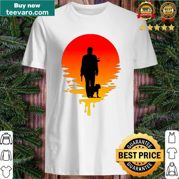 Silhouette of John Wick against a sunset background