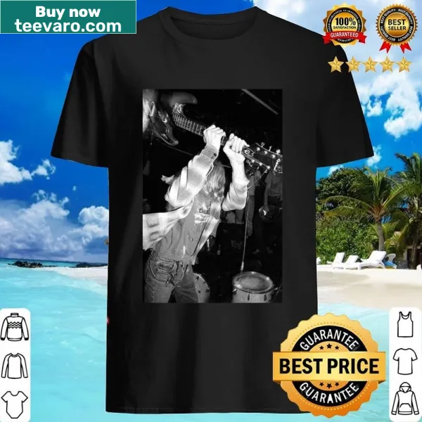 Graphic shirt featuring a guitar and fun music-themed text