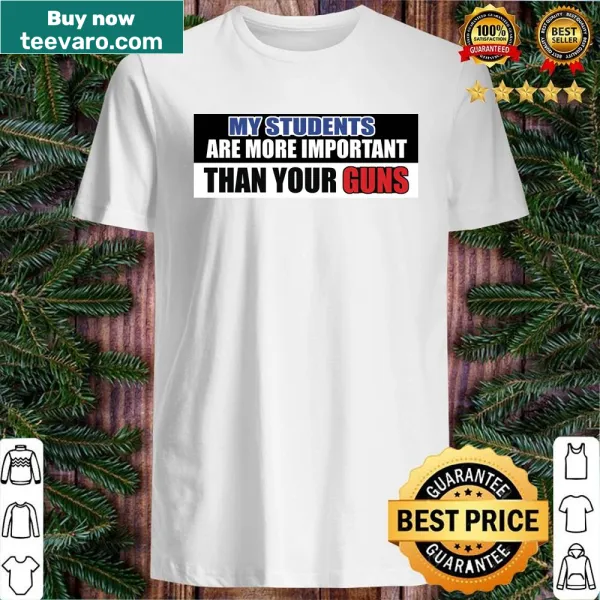 Funny teacher shirt with text emphasizing students over guns.