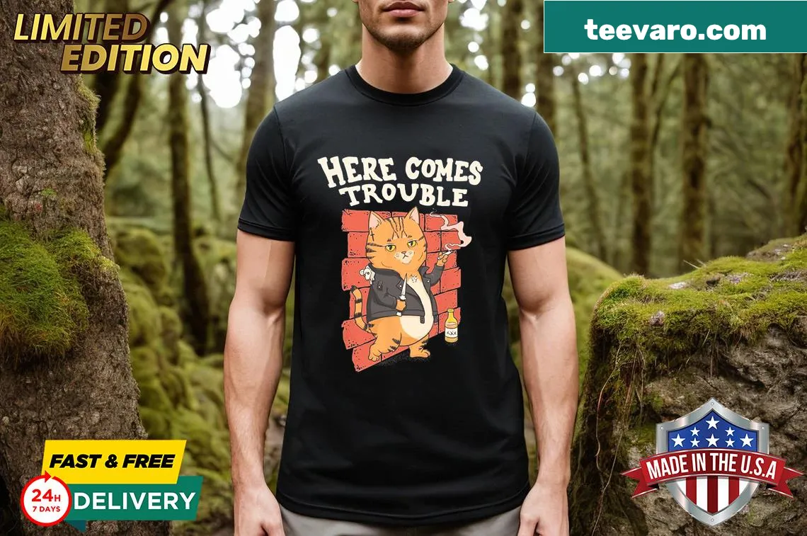 Cartoon cat design with the phrase 'Here Comes Trouble' — on a men's t-shirt