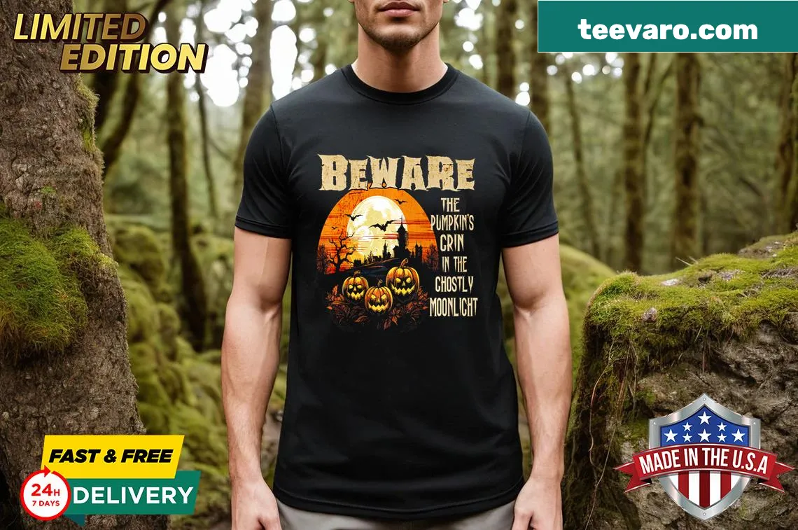 Halloween t-shirt with a spooky grinning pumpkin graphic. — on a men's t-shirt