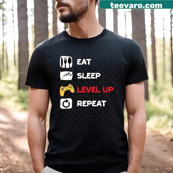 Funny gaming-themed T-shirt featuring 'Eat Sleep Game Repeat' text.