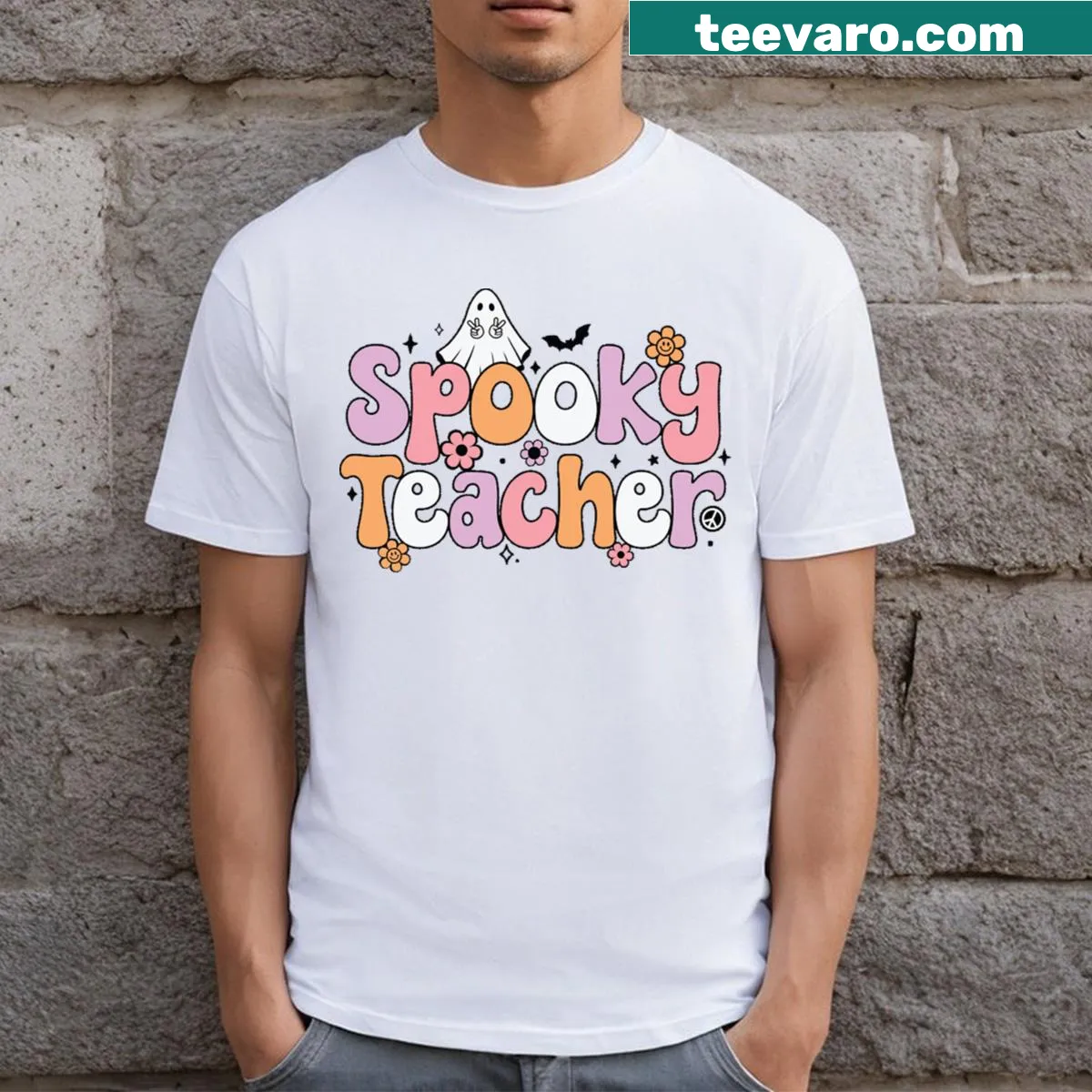 Spooky Teacher T-shirt with playful skeleton and pumpkin graphics. — on a men's t-shirt