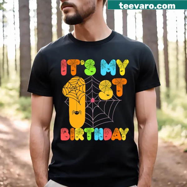 Cute T-shirt for kids celebrating their 1st Halloween birthday with festive graphics.