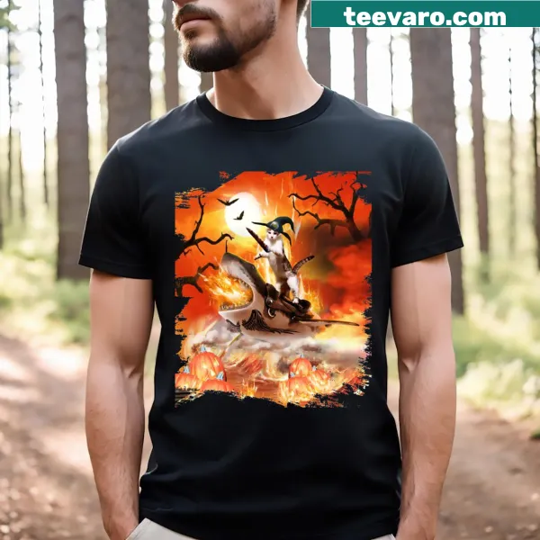 T-shirt featuring a witch cat riding a shark graphic