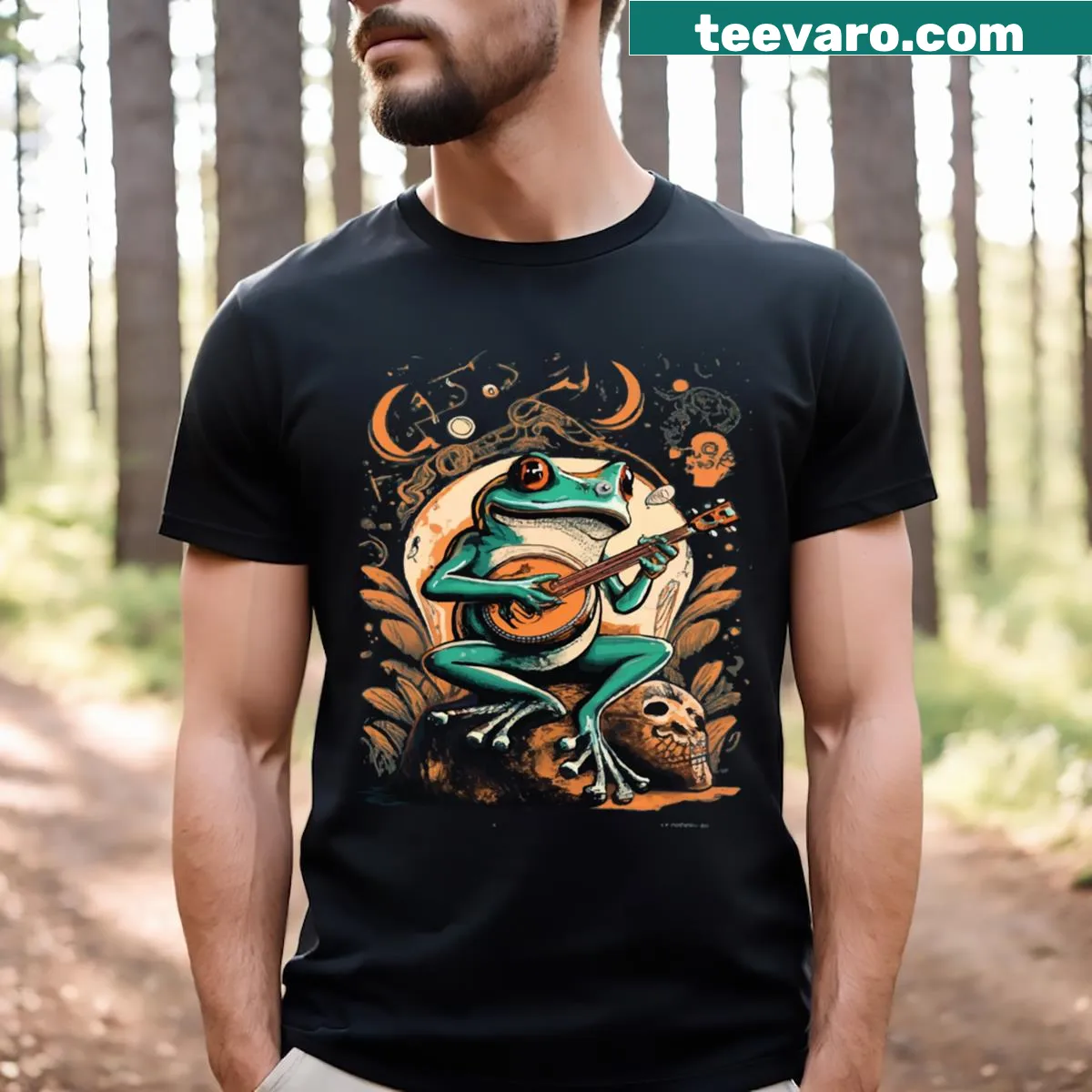 Humorous t-shirt featuring a frog playing banjo on a skull — on a men's t-shirt