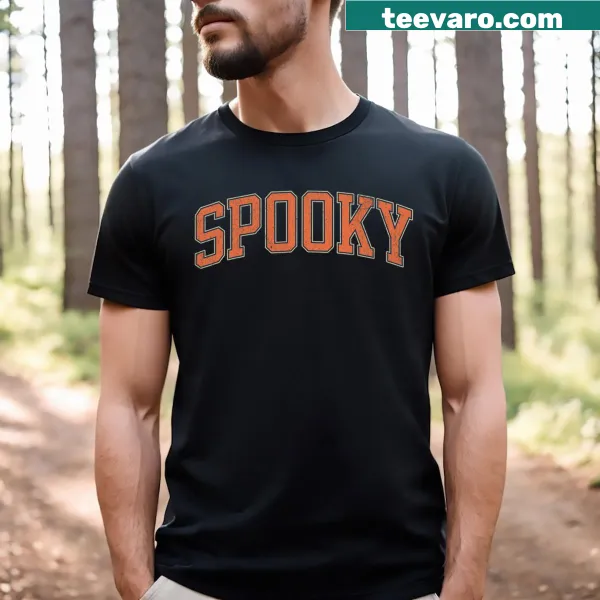 Halloween-themed collage tee with spooky elements and 'Stay Spooky' text