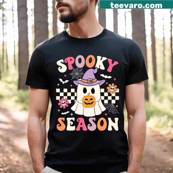 Retro ghost holding a pumpkin in a Halloween-themed t-shirt