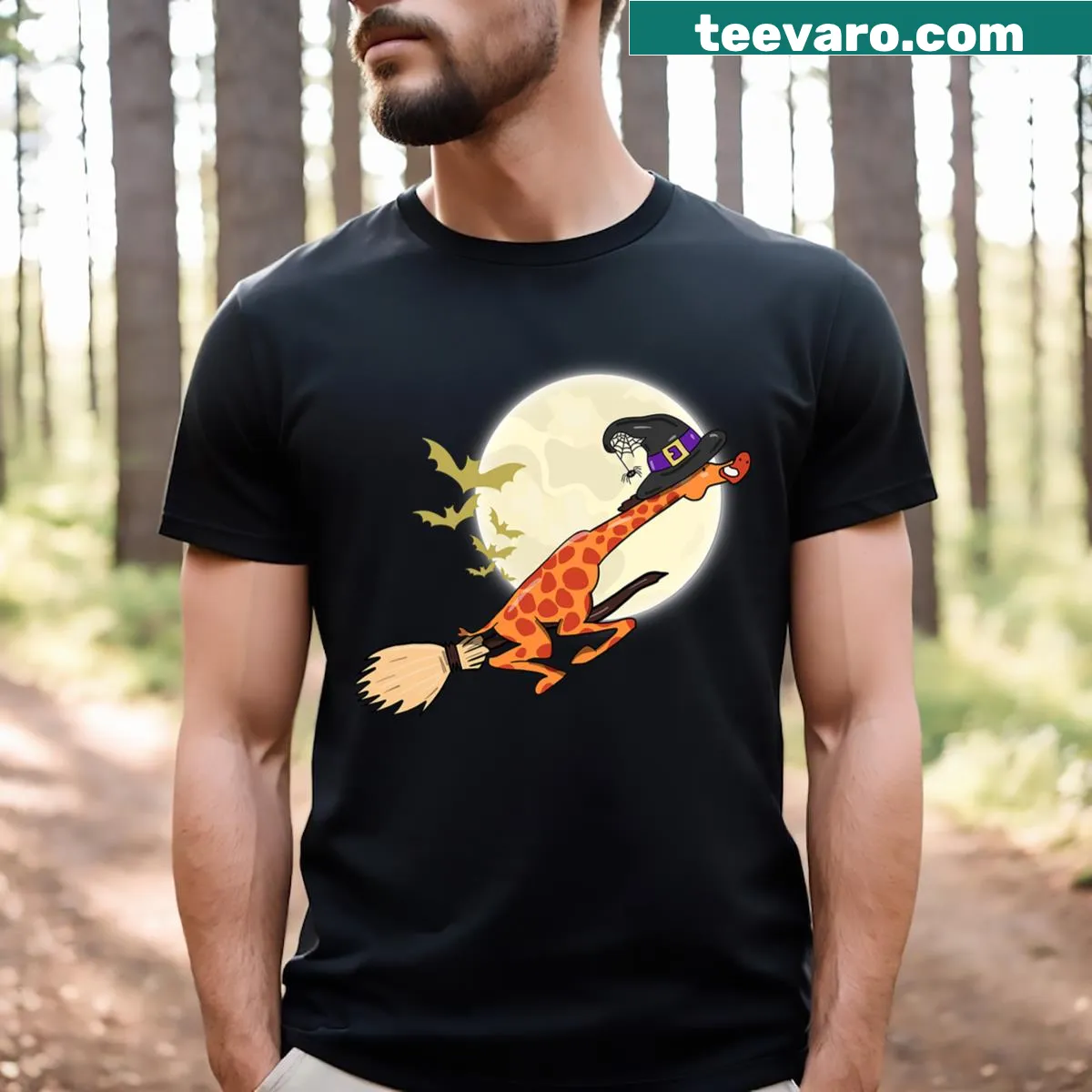 Playful Halloween giraffe ride with witch graphic T-shirt — on a men's t-shirt