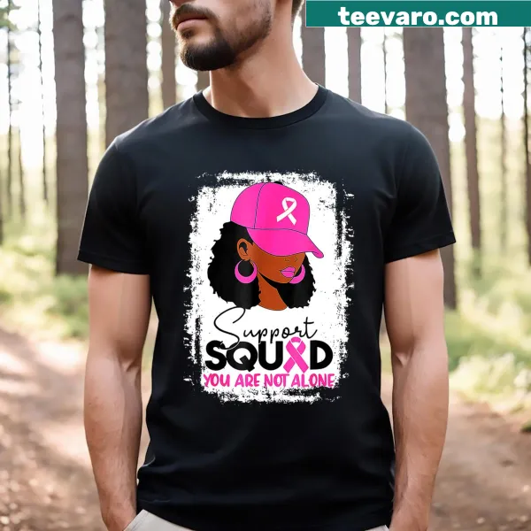 Black T-shirt with cartoon-style graphic and text supporting breast cancer awareness