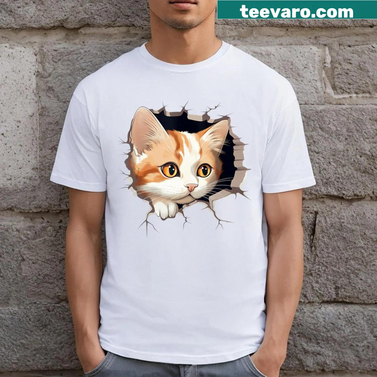 Cute kitten peeking from torn cloth graphic t-shirt — on a men's t-shirt