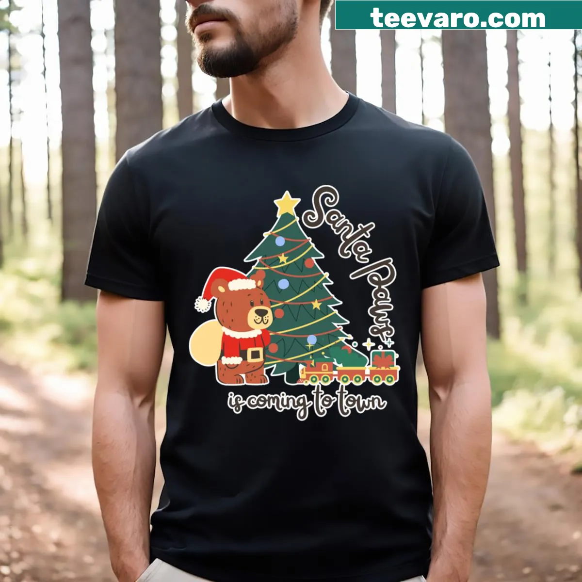 Cute Santa bear with Christmas tree graphic on t-shirt — on a men's t-shirt