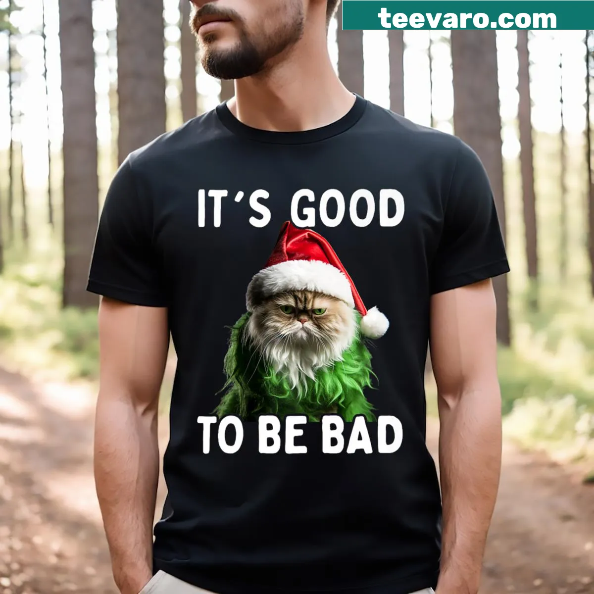 Funny Christmas t-shirt with cat and 'It's Good To Be Bad' text — on a men's t-shirt