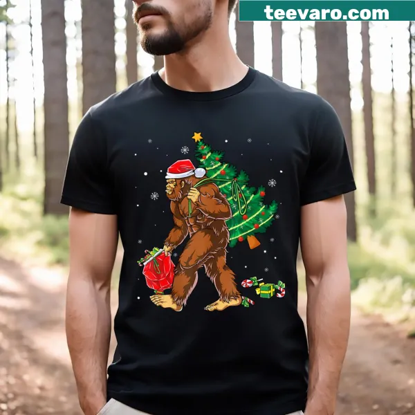 Illustration of Bigfoot carrying a Christmas tree on a t-shirt