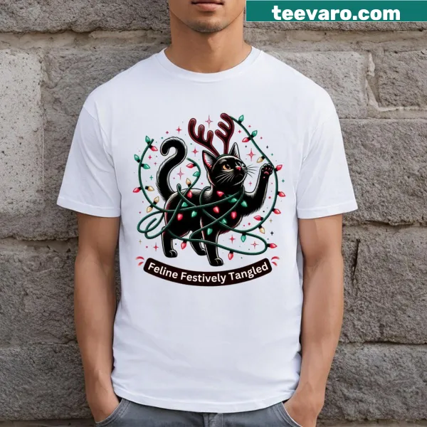 Cute black cat tangled in Christmas lights on T-shirt