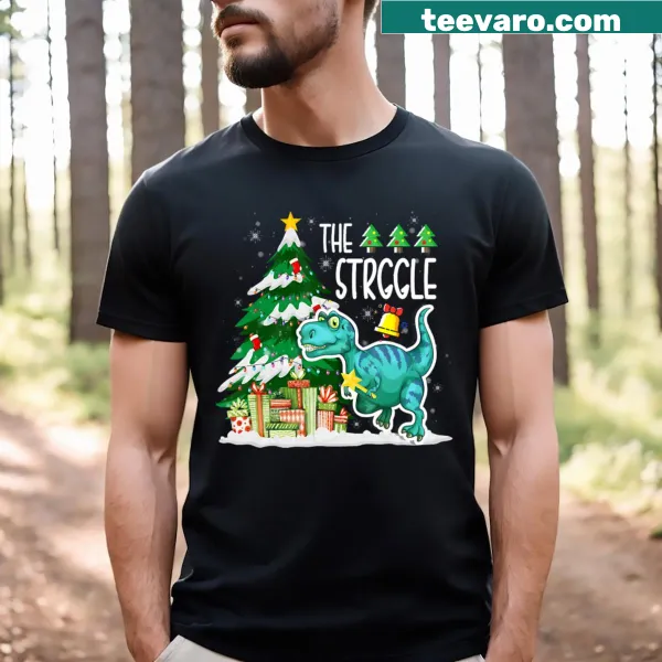 Cartoon dinosaur struggling with Christmas decorations on t-shirt