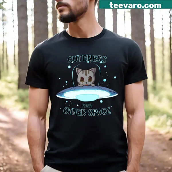 Whimsical grey cat floating in space illustration on a T-shirt