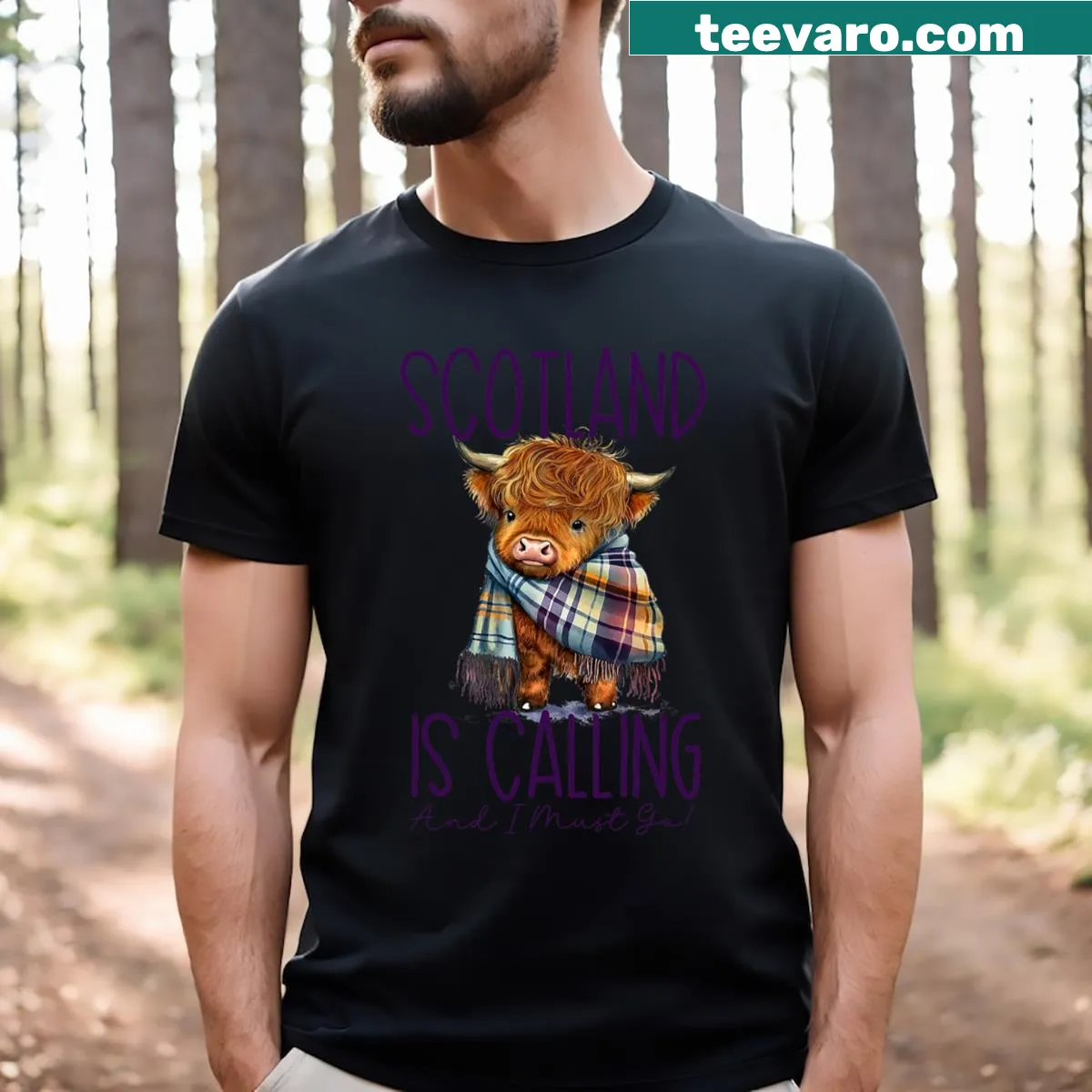 Highland cow illustration with 'Scotland Is Calling' text on t-shirt — on a men's t-shirt