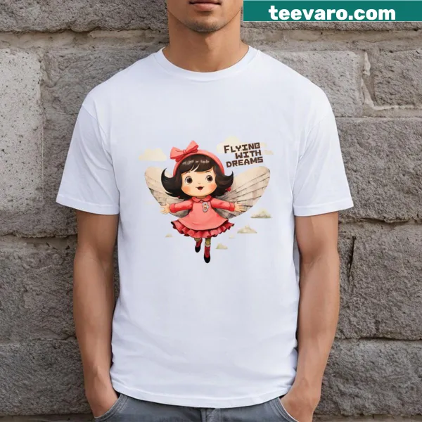 T-shirt featuring whimsical imagery of flying and dreams