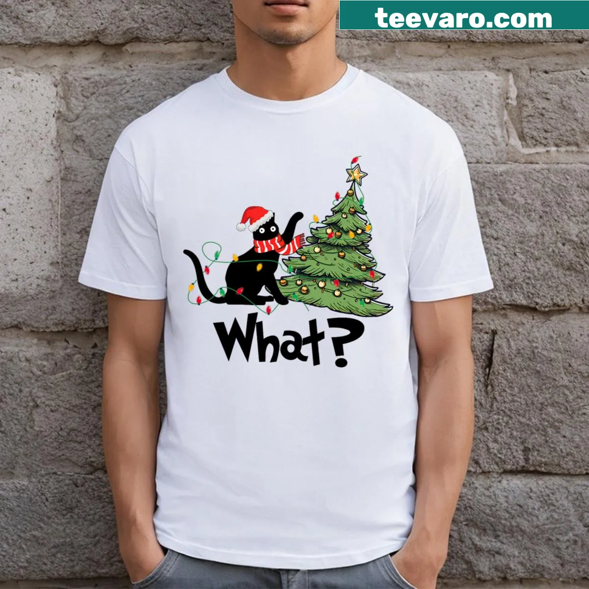 Funny black cat pushing over Christmas tree graphic on a T-shirt — on a men's t-shirt