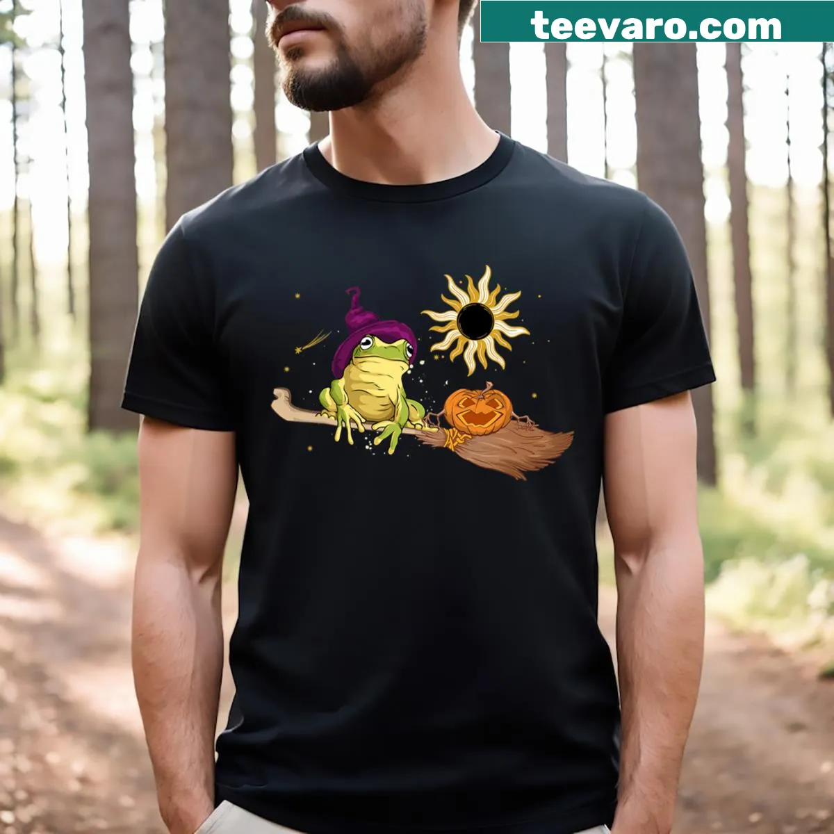 Cute Halloween t-shirt with frog witch and pumpkin graphic — on a men's t-shirt