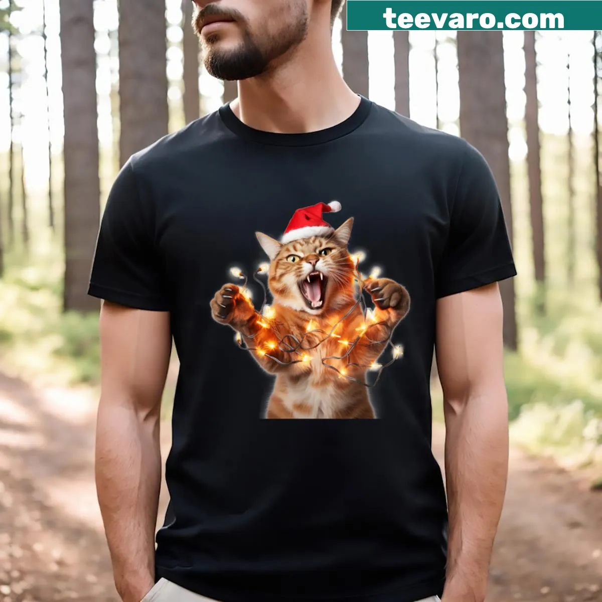 Funny Christmas cat tangled in lights graphic t-shirt — on a men's t-shirt