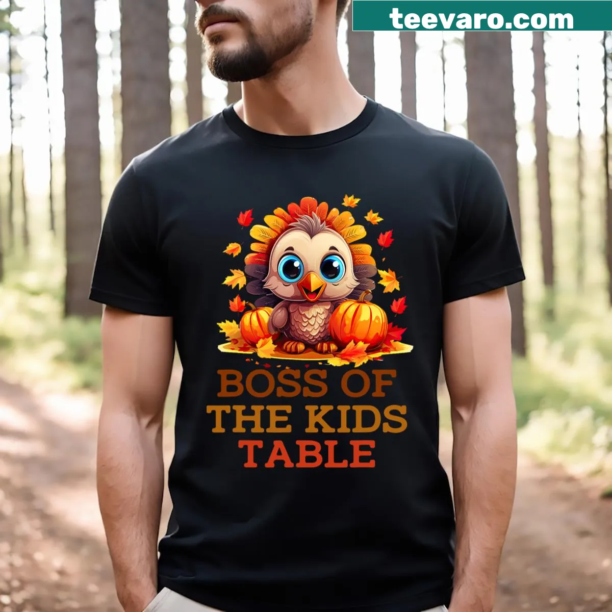 Humorous t-shirt declaring 'Boss of the Kids Table' for Thanksgiving — on a men's t-shirt
