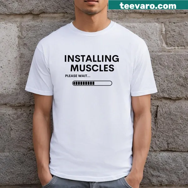 Funny fitness T-shirt with 'Installing Muscles Please Wait' text