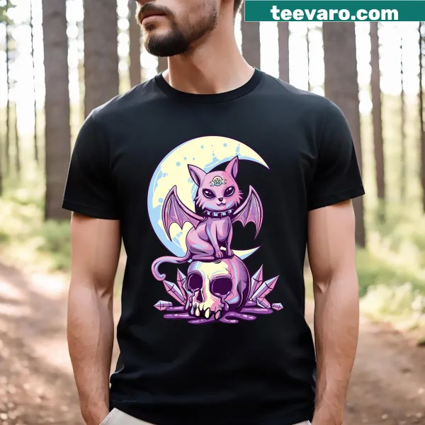 Cute T-shirt featuring a pastel goth cat with skulls and wiccan themes