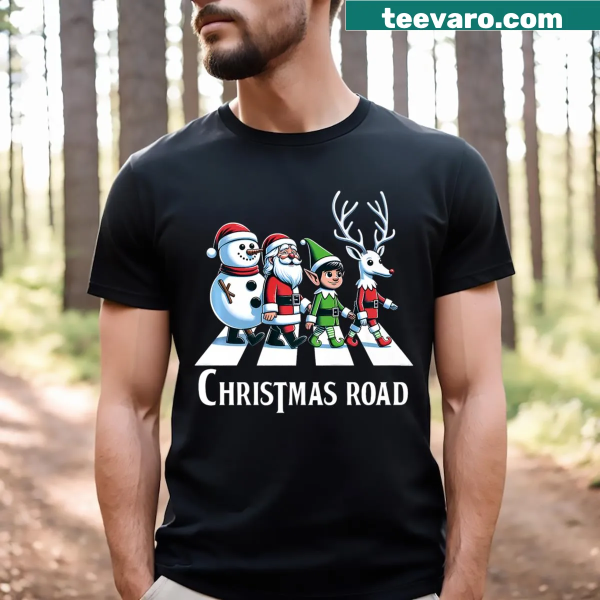 T-shirt depicting a snowy Christmas scene with Santa, snowman, and reindeer — on a men's t-shirt