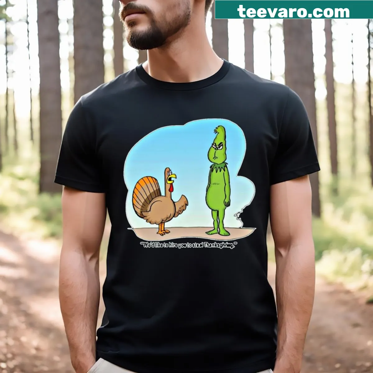 Funny T-shirt with the saying 'Hire Grinch To Steal Thanksgiving Day' in playful typography. — on a men's t-shirt