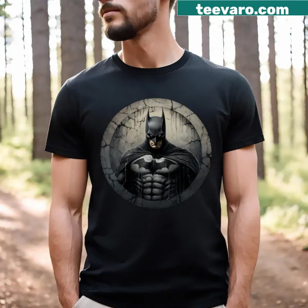 Caped figure illustration on a T-shirt depicting a broken city